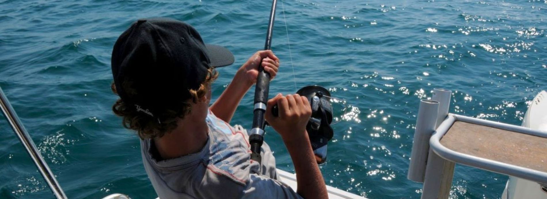 man fishing on the ocean