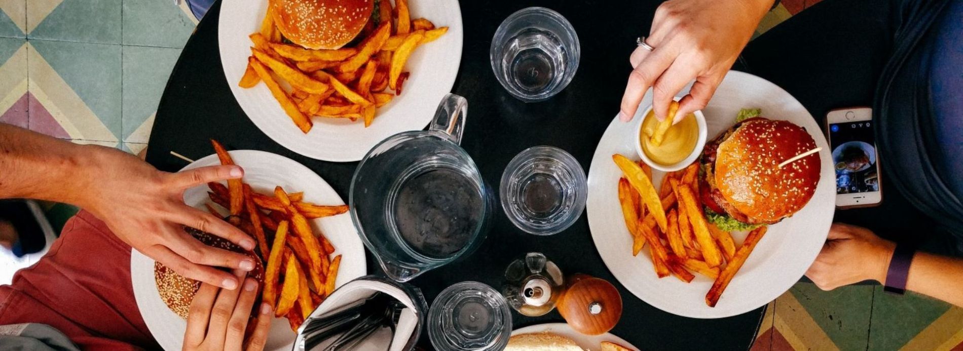 eating burgers at restaurant