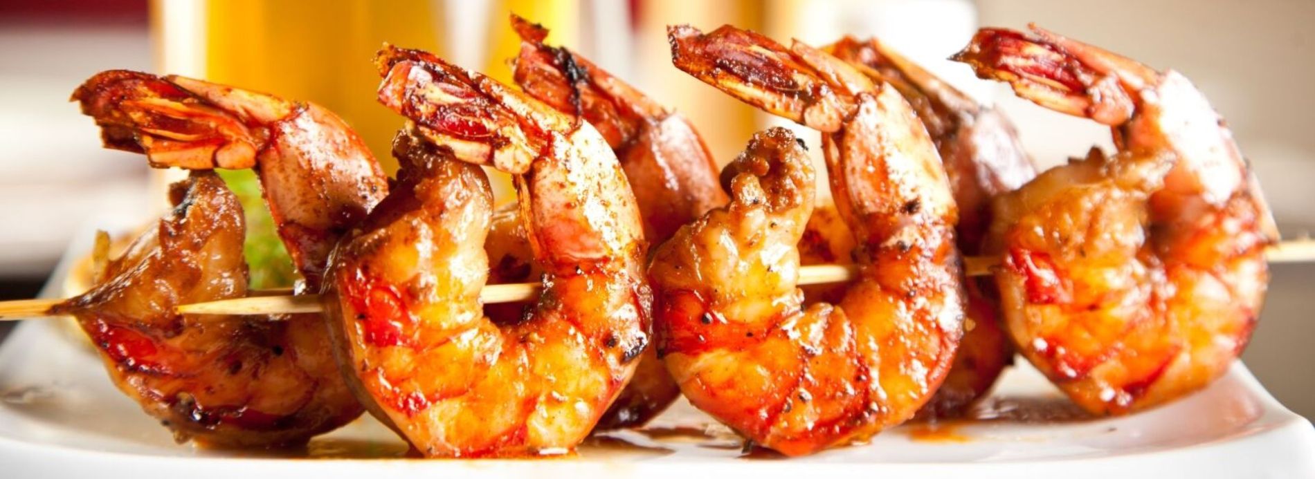 Grilled shrimp kebabs and beer.