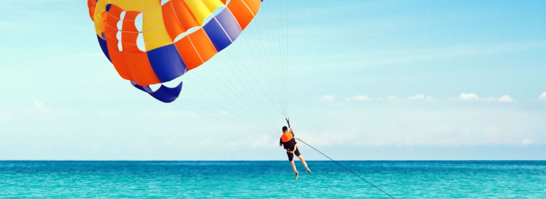 Man parasailing in the waters of Anna Maria Island