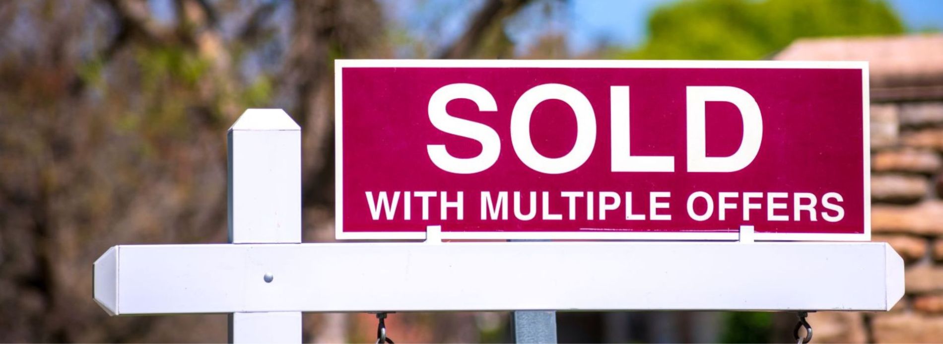 Sold sign on home