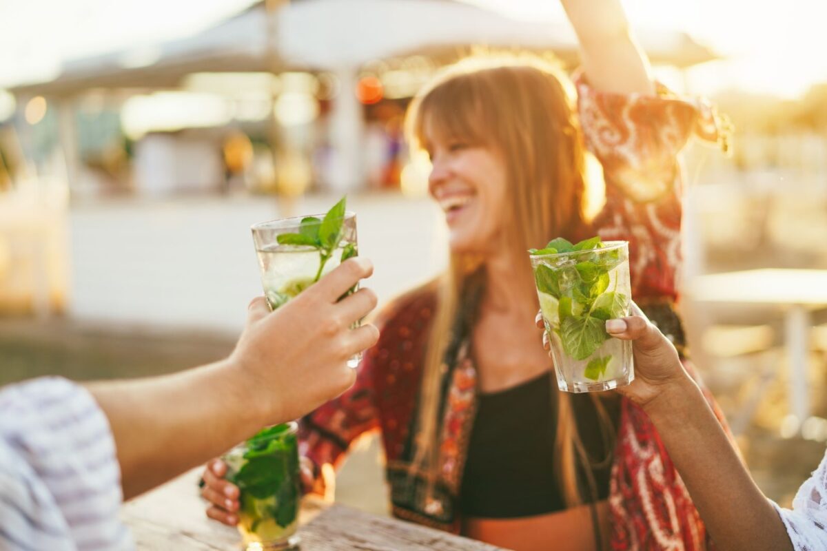 woman drinking a mojito