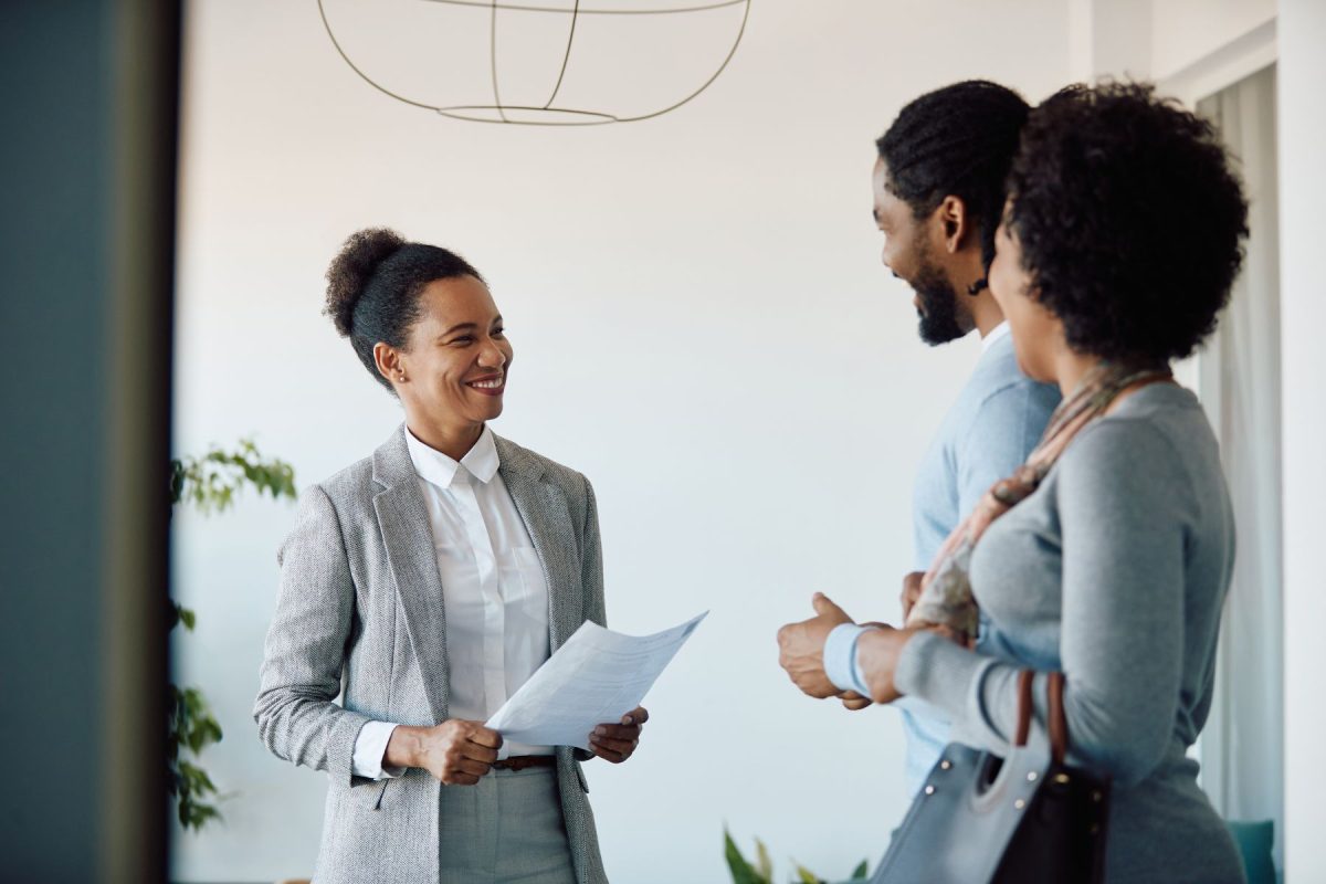 real estate agent working with couple
